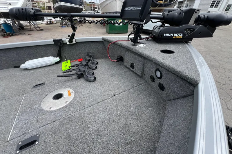 Slide: The Image of 2014 Alumacraft Competitor 165 Tiller boat deck with Minn Kota Ulterra trolling motor. - 13