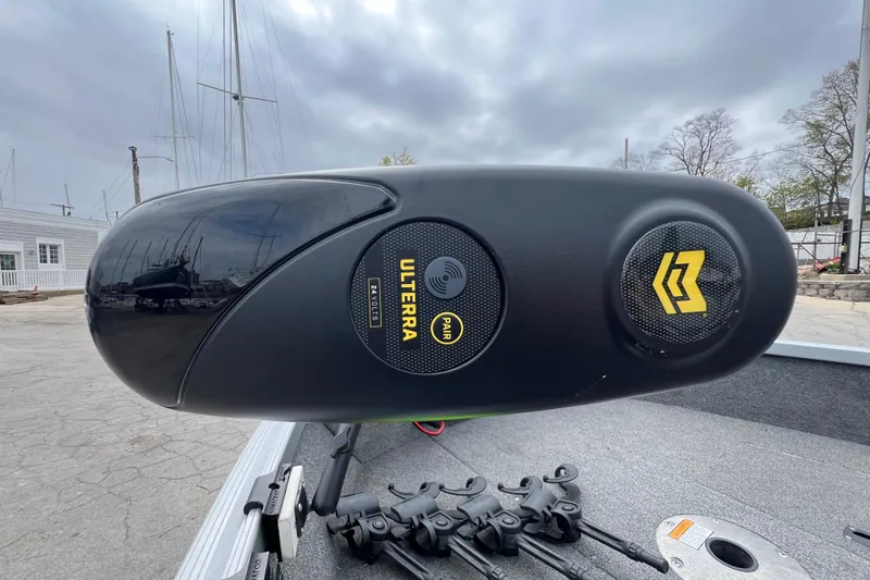 Slide: The Image of 2014 Alumacraft Competitor 165 Tiller with Ulterra motor in a marina setting. - 16