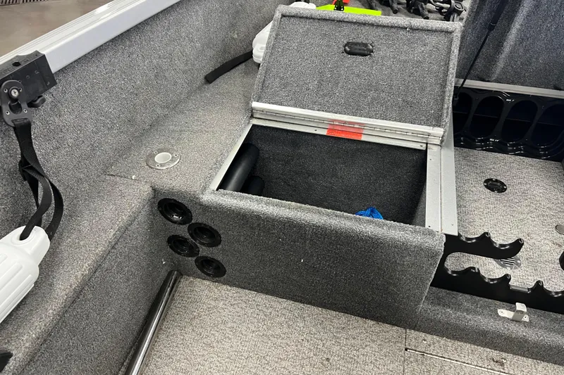 Slide: The Image of 2014 Alumacraft Competitor 165 Tiller boat interior with open storage compartment. - 17