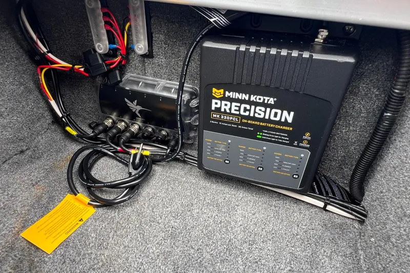 Slide: The Image of Minn Kota Precision battery charger in 2014 Alumacraft Competitor 165 Tiller boat. - 22