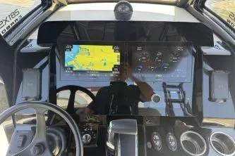 Slide: The Image of 2024 Scout 281 XSS boat dashboard with navigation and control displays. - 14
