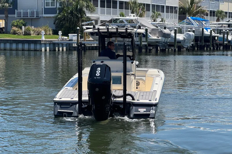 Slide: The Image of 2024 Scout 281 XSS boat with Mercury 400 V10 engine on a calm waterway. - 6