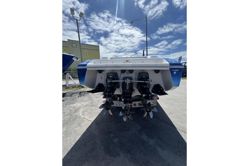 Slide: The Image of Rear view of a 2006 Donzi 43 ZR boat with dual propellers under a clear sky. - 10