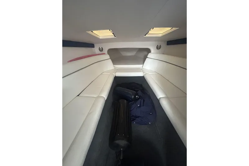 Slide: The Image of Interior cabin of a 2006 Donzi 43 ZR boat with white seating and skylights. - 12