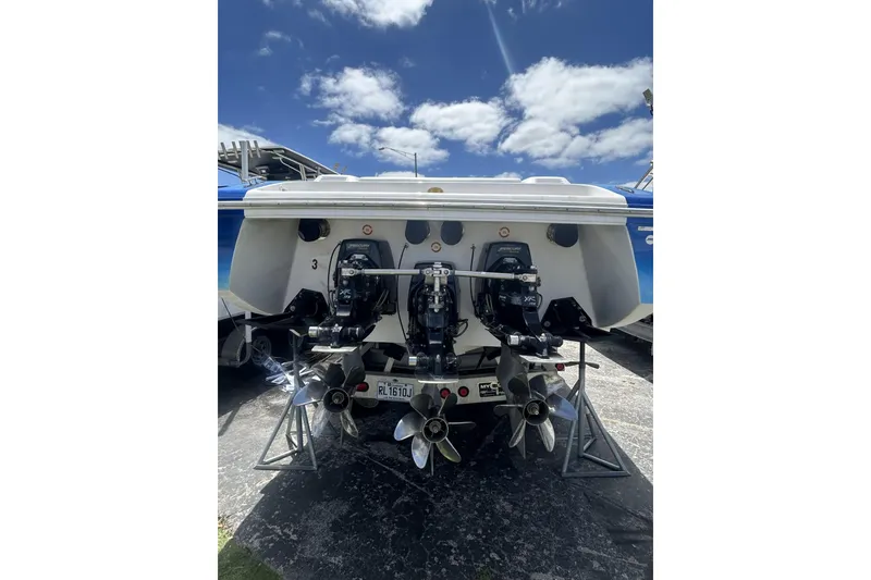 Slide: The Image of Rear view of a 2006 Donzi 43 ZR boat with dual outboard engines. - 18