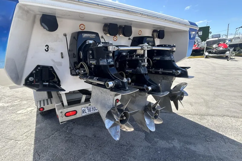 Slide: The Image of 2006 Donzi 43 ZR boat with Mercury engines and propellers, parked on a trailer. - 19