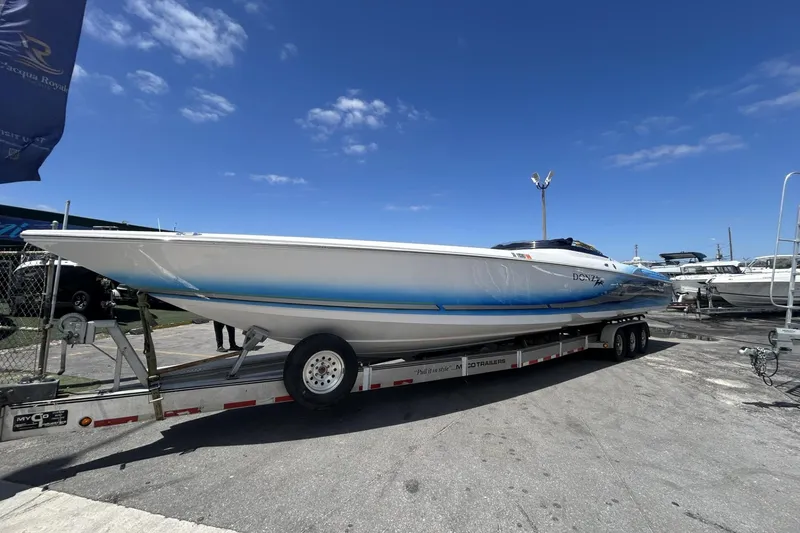 Slide: The Image of 2006 Donzi 43 ZR speedboat on trailer under clear blue sky. - 25