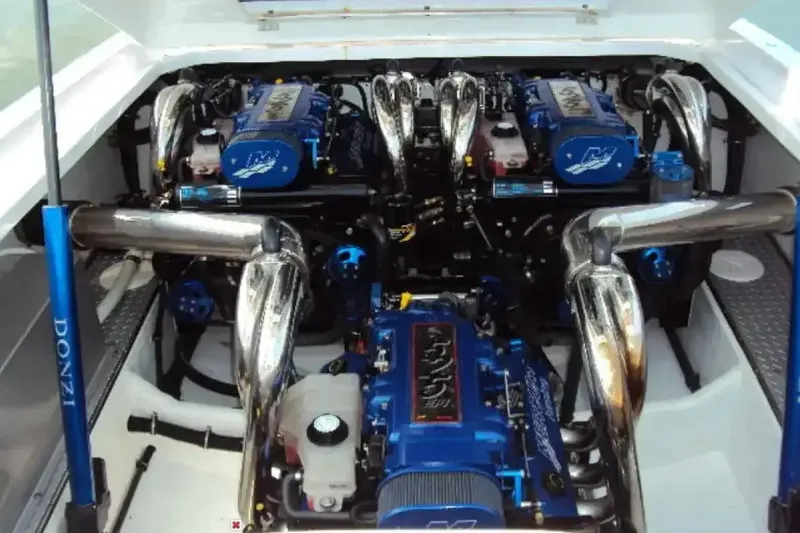 Slide: The Image of Engine compartment of a 2006 Donzi 43 ZR boat, featuring powerful dual engines. - 30