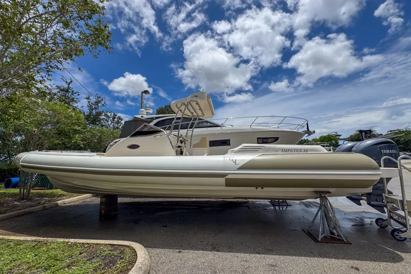 The Image of 2023 Tender Impertus 36 boat on display under a partly cloudy sky. - 1