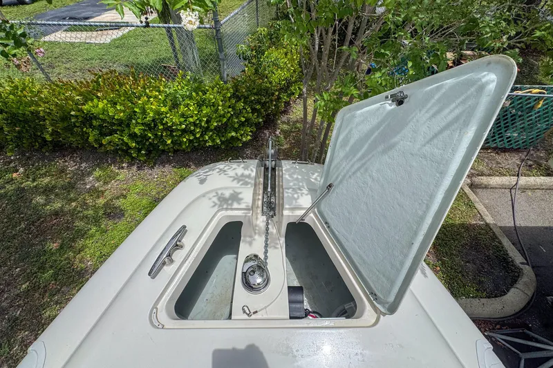 Slide: The Image of Open hatch on 2023 Tender Impertus 36 boat, showing storage compartment. - 14