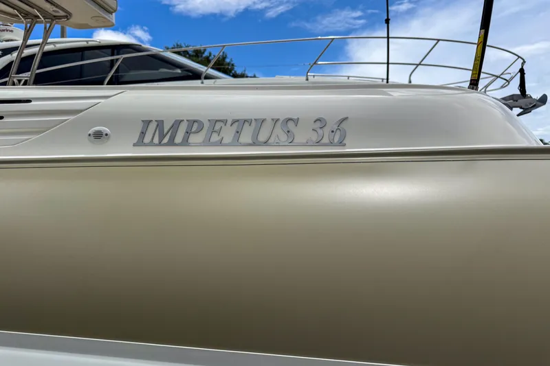 Slide: The Image of 2023 Tender Impertus 36 boat side view with clear branding. - 29