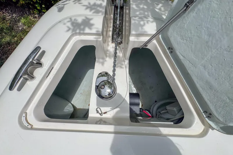 Slide: The Image of Open hatch of 2023 Tender Impertus 36 boat, showing anchor chain and storage compartment. - 31