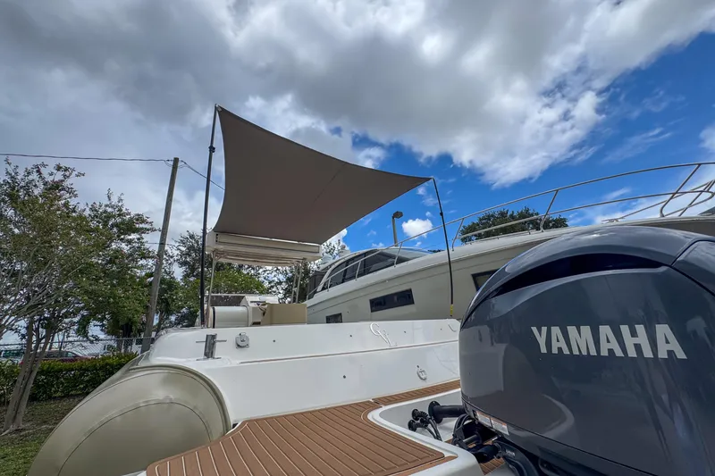 Slide: The Image of 2023 Tender Impertus 36 boat with Yamaha engine under a cloudy sky. - 47
