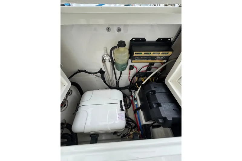 Slide: The Image of 2022 World Cat 325 DC boat engine compartment with wiring and components. - 13