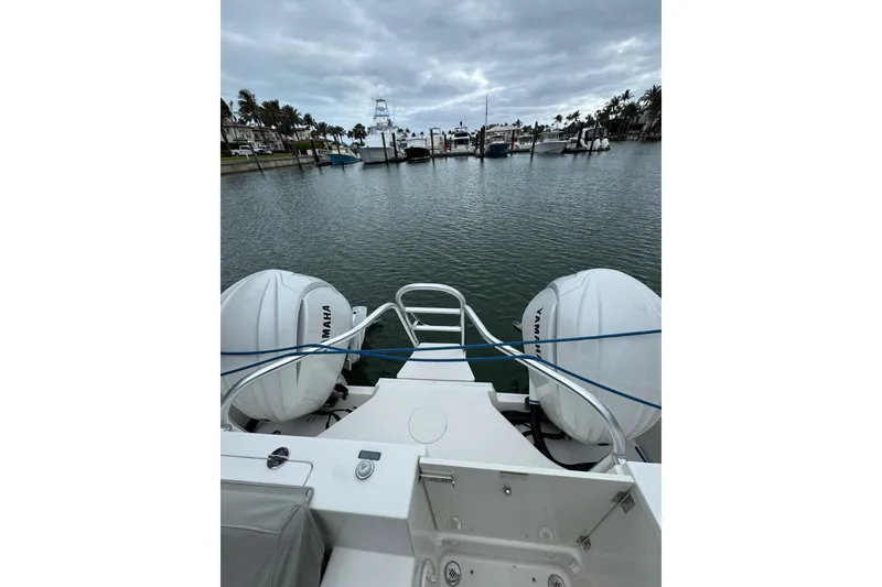 Slide: The Image of 2022 World Cat 325 DC boat with Yamaha engines docked in a marina. - 18