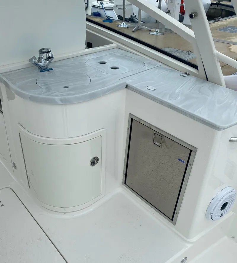 Slide: The Image of Galley area on a 2022 World Cat 325 DC boat. - 22