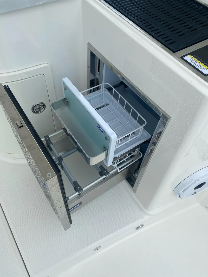 Slide: The Image of Built-in refrigerator on World Cat 325 DC boat, 2022 model. - 32