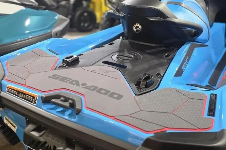 Slide: The Image of 2026 Sea-Doo RXT-X 325 jet ski, blue with black and red accents, rear view. - 9