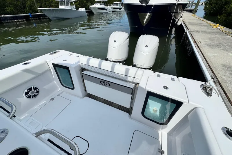 Slide: The Image of 2024 Sportsman Open 262 Center Console boat docked with dual engines visible. - 19