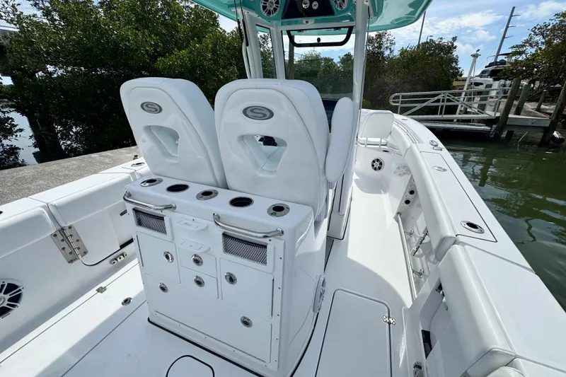 Slide: The Image of 2024 Sportsman Open 262 Center Console boat interior with seating and storage compartments. - 21