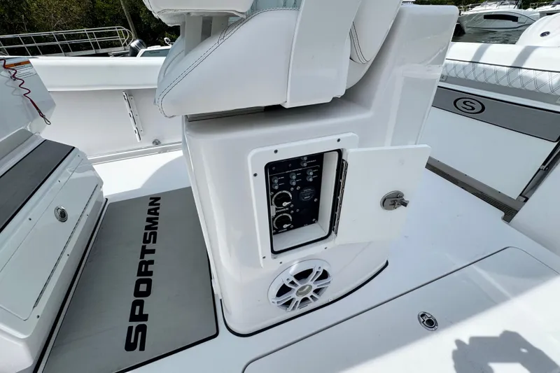Slide: The Image of 2024 Sportsman Open 262 Center Console boat interior with control panel and speaker. - 25