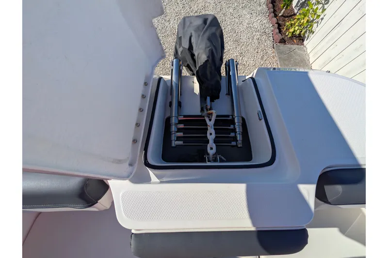 Slide: The Image of Bayliner DX 2000 boat storage compartment with ladder, 2022 model. - 13