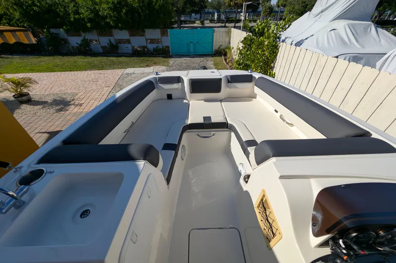 Slide: The Image of 2022 Bayliner DX 2000 boat interior with spacious seating and modern design. - 3