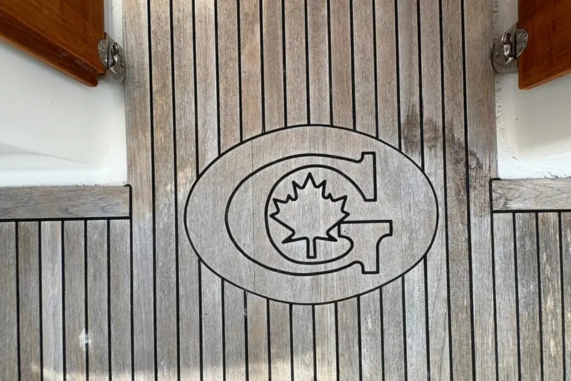 Slide: The Image of Teak deck of 2016 Gozzard 41 RC with engraved logo and maple leaf design. - 40