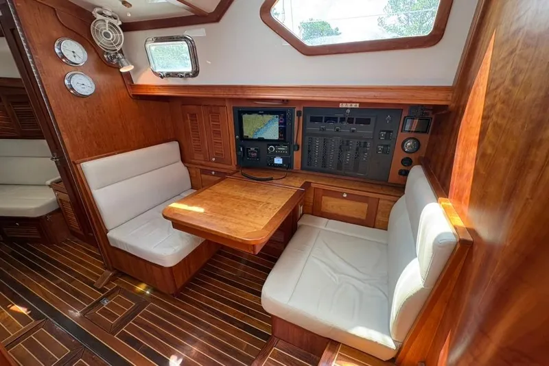 Slide: The Image of Interior of 2016 Gozzard 41 RC yacht with navigation station and seating area. - 13