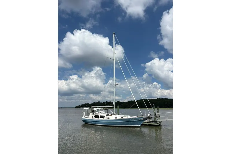 Slide: The Image of Sailboat Gozzard 41 RC 2016 docked under a cloudy sky. - 1