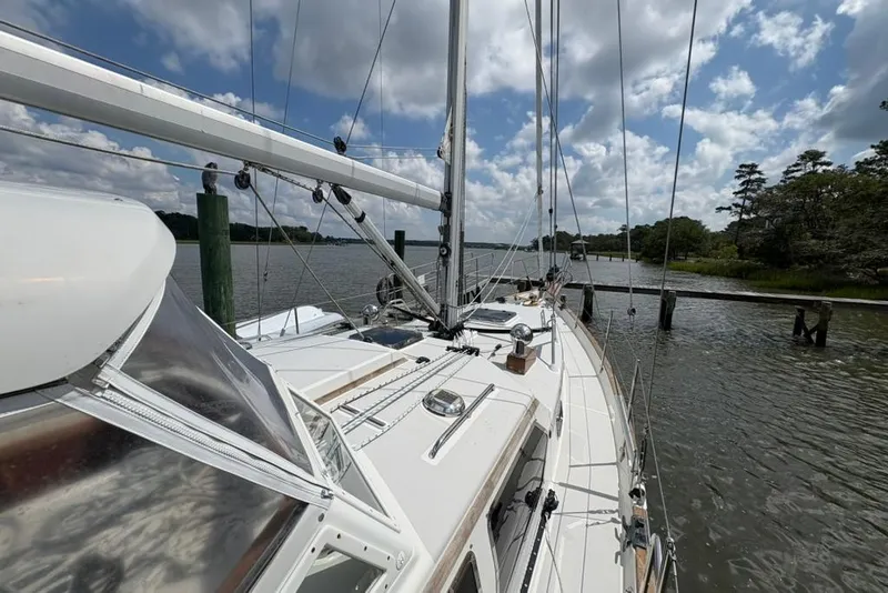 Slide: The Image of Sailing on a 2016 Gozzard 41 RC yacht in a serene river setting. - 42