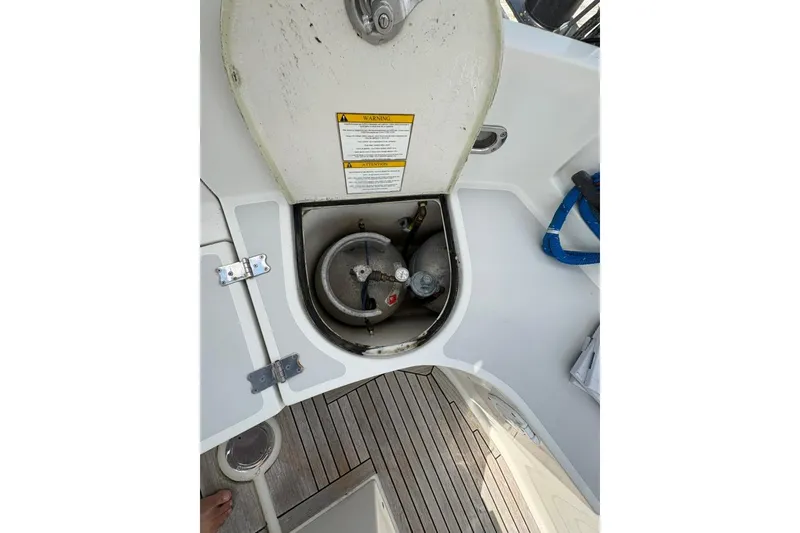 Slide: The Image of Open hatch on 2016 Gozzard 41 RC sailboat, revealing storage compartment and equipment. - 35