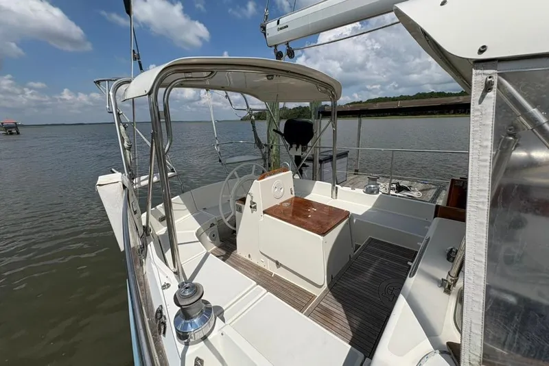 Slide: The Image of 2016 Gozzard 41 RC sailboat cockpit with helm, docked on a sunny day. - 43