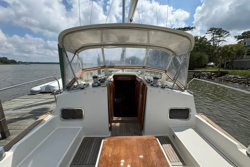 Slide: The Image of Sailboat cockpit view of 2016 Gozzard 41 RC docked by a scenic river. - 32