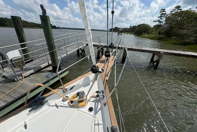 Slide: The Image of Sailboat Gozzard 41 RC 2016 docked by a scenic riverside pier. - 44