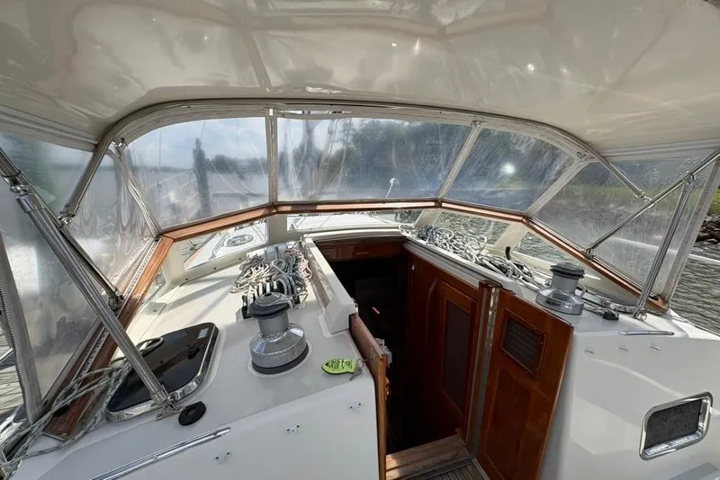 Slide: The Image of Cockpit view of 2016 Gozzard 41 RC sailboat with wooden accents and navigation equipment. - 39