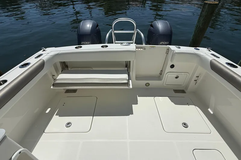 Slide: The Image of 2021 World Cat 280 DC-X boat deck with dual engines and seating area. - 16