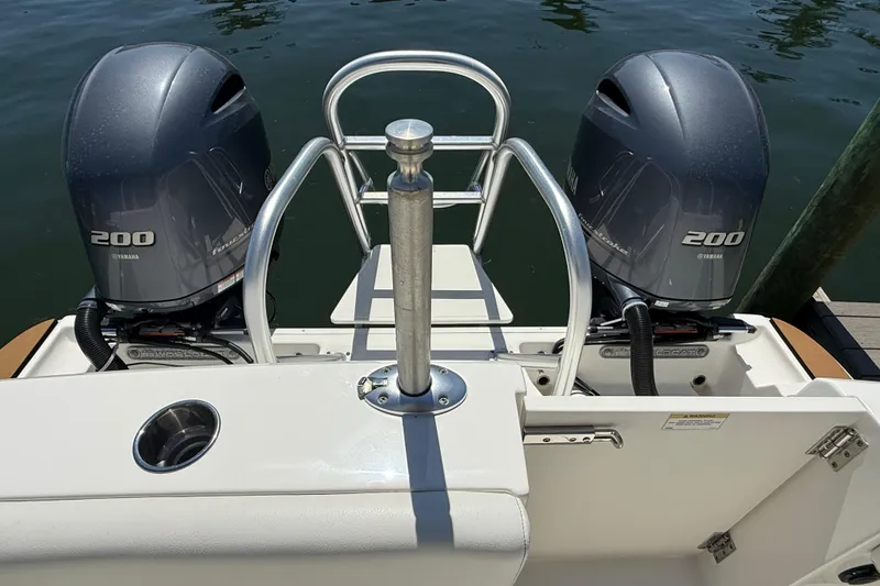 Slide: The Image of 2021 World Cat 280 DC-X boat with dual Yamaha 200 engines at dock. - 18