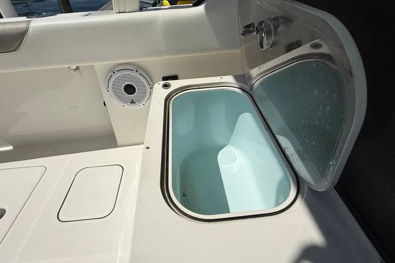 Slide: The Image of Open storage compartment on 2021 World Cat 280 DC-X boat deck. - 21
