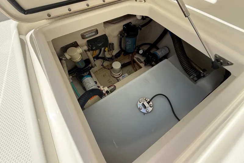Slide: The Image of Engine compartment of 2021 World Cat 280 DC-X boat, showing mechanical components. - 26