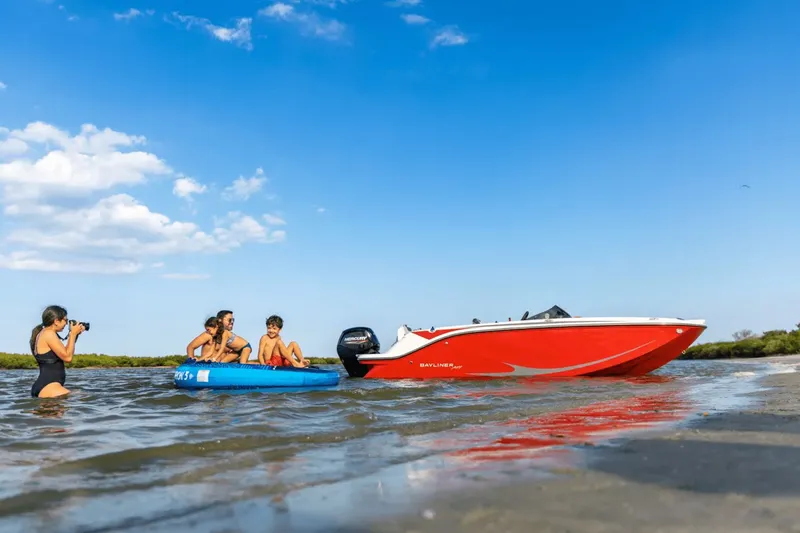 The Image of 2024 Bayliner M19 boat at beach with family and photographer. - 0