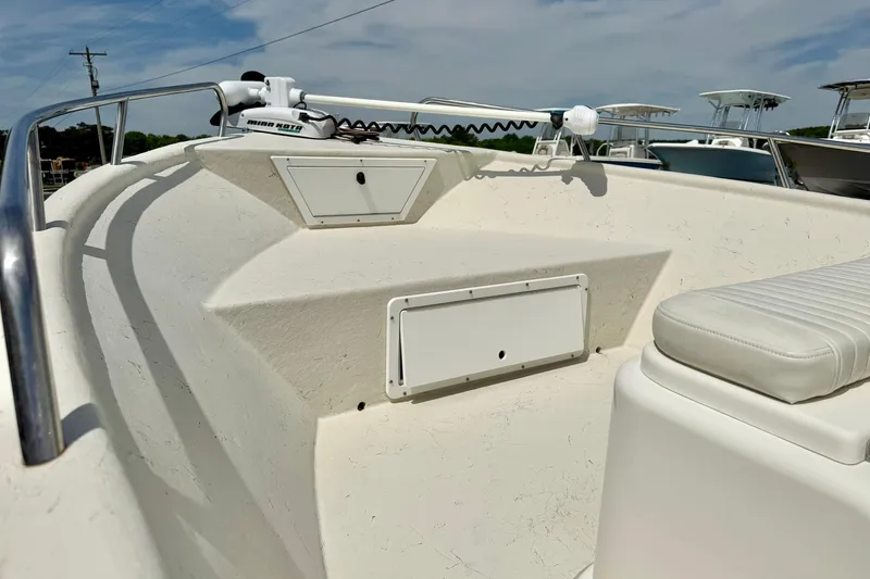 Slide: The Image of 2014 May-Craft 1800 Skiff boat interior with seating and storage compartments. - 10