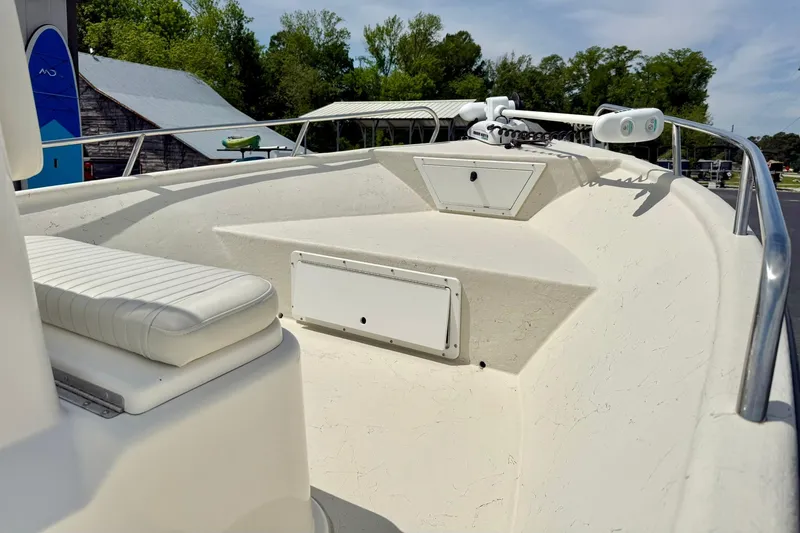 Slide: The Image of 2014 May-Craft 1800 Skiff boat interior with seating and storage compartments. - 11