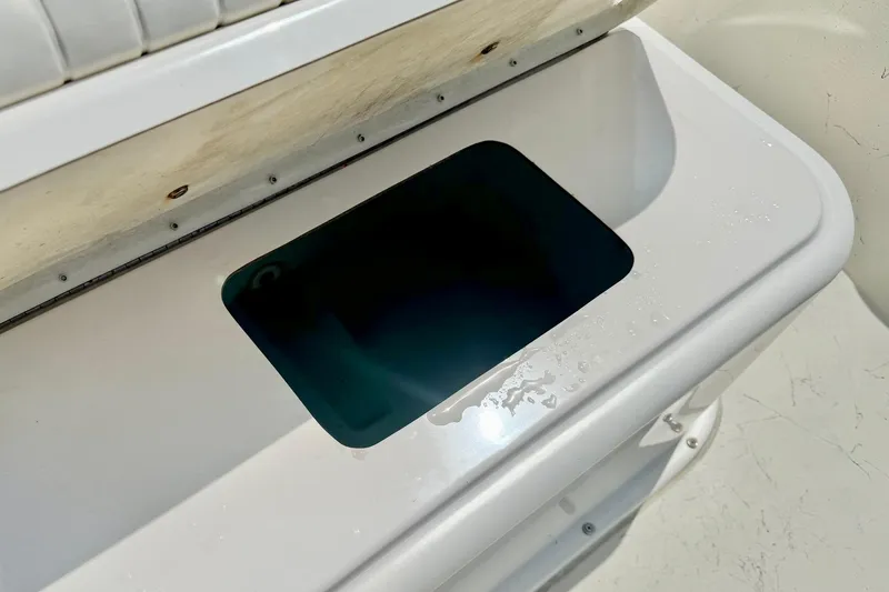 Slide: The Image of Open storage compartment on a 2014 May-Craft 1800 Skiff boat. - 19