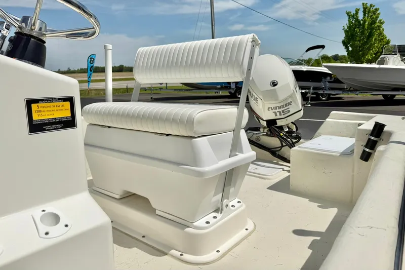 Slide: The Image of 2014 May-Craft 1800 Skiff with Evinrude 115 engine, featuring white seating and console. - 20