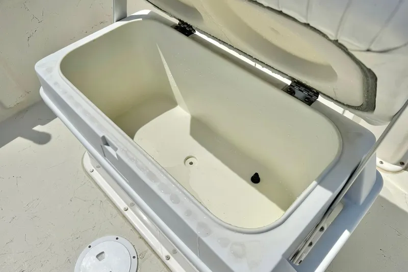 Slide: The Image of Open storage compartment on a 2014 May-Craft 1800 Skiff boat. - 24