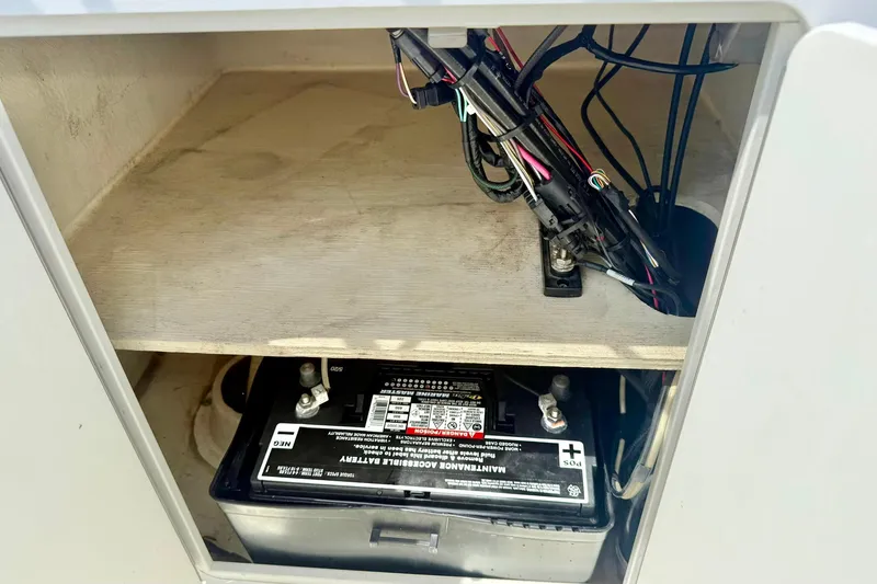 Slide: The Image of Battery compartment of a 2014 May-Craft 1800 Skiff with wiring visible. - 28