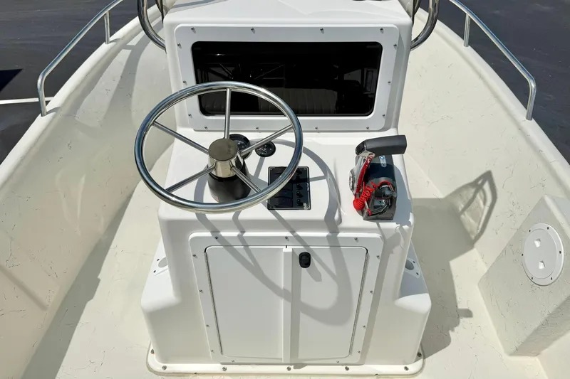 Slide: The Image of 2014 May-Craft 1800 Skiff boat console with steering wheel and controls. - 3
