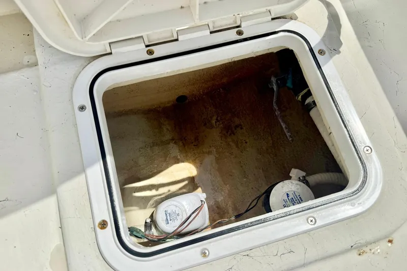 Slide: The Image of Open hatch of a 2014 May-Craft 1800 Skiff, showing interior components. - 32