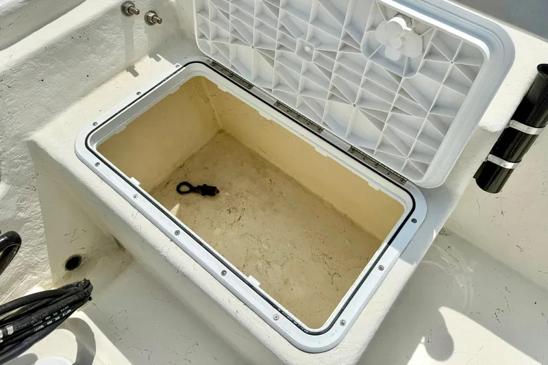 Slide: The Image of Open storage compartment on a 2014 May-Craft 1800 Skiff boat. - 33